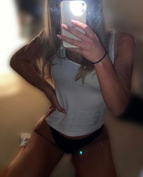 Sexy wasp-waisted babe shows off her hot ass & her firm tits in lingerie