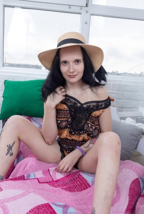 Sexy brunette amateur strips & plays with her hairy pussy while reading a book