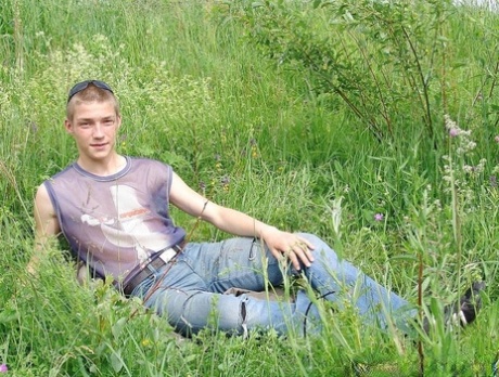 Gay amateur Hubert stripping naked and masturbating in the meadow