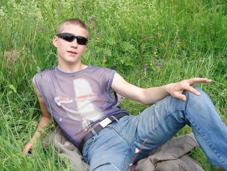 Gay amateur Hubert stripping naked and masturbating in the meadow