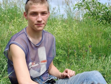 Gay amateur Hubert stripping naked and masturbating in the meadow