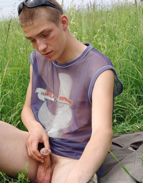 Gay amateur Hubert stripping naked and masturbating in the meadow