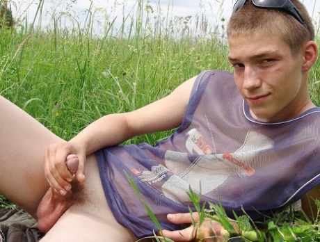 Gay amateur Hubert stripping naked and masturbating in the meadow