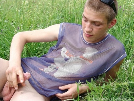 Gay amateur Hubert stripping naked and masturbating in the meadow