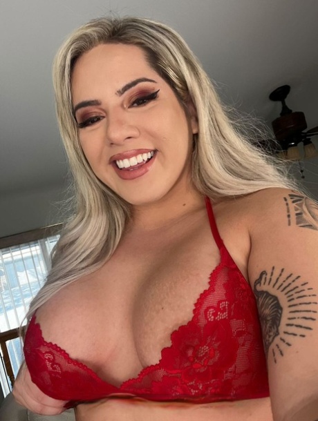 Curvy blonde fatty Karlita the K removes her red dress & flaunts her big tits