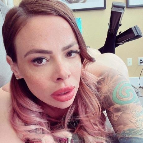 Tattooed schoolgirl Lili Cocksinhell flirts with her teacher before stripping
