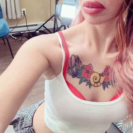 Tattooed schoolgirl Lili Cocksinhell flirts with her teacher before stripping