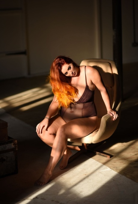 Chubby redhead Lucy Vixen shows off her big tits and her great ass