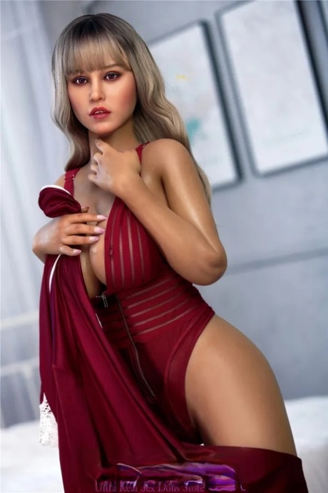 Attractive sex doll Opal poses seductively and unveils her big tits