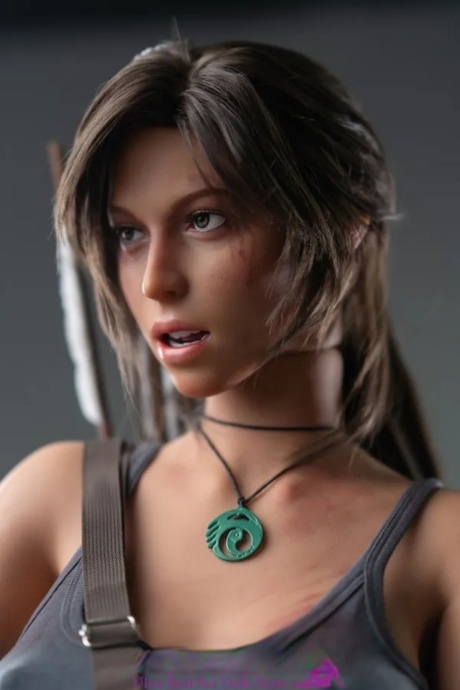 Realistic game character sex doll Lara Croft exposes her figure and big tits