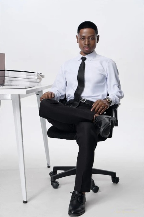 Ebony male silicone sex doll strips at the office & shows his six pack and ass