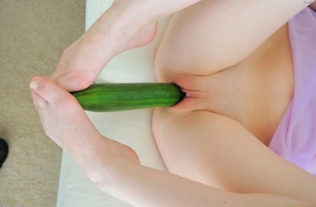 Lovely babe Victoria destroying her tight shaved pussy with a huge cucumber - pornpics.de