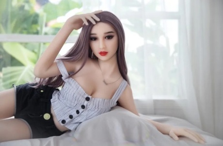 Pretty sex doll shows her puffy pussy and her beautiful big boobs