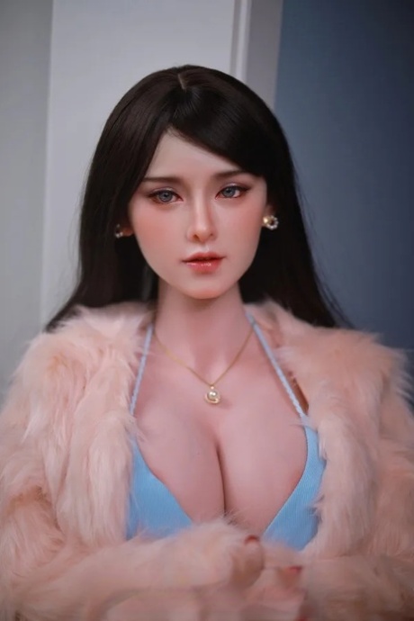 Dark-haired sex doll shows her flawless petite body wearing sexy lingerie