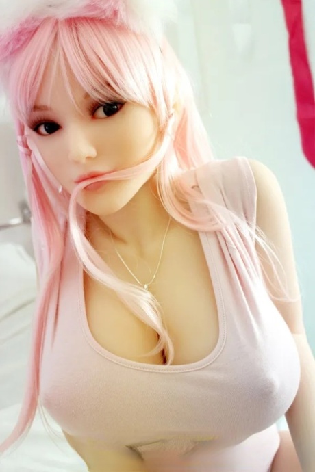 Curvy pink haired sex doll exposes her amazing big breast and poses