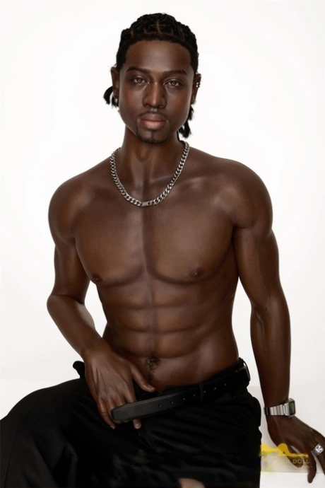 Good-looking black male sex doll shows his athletic body while shirtless