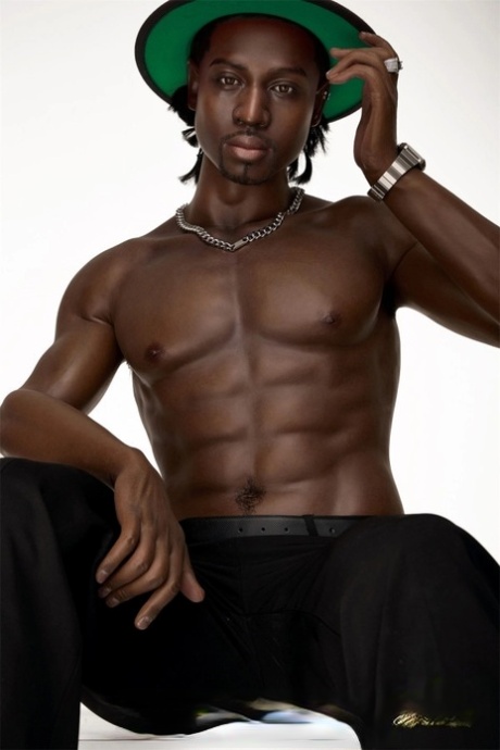 Good-looking black male sex doll shows his athletic body while shirtless