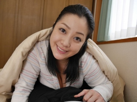 Hot Japanese wife Minako Komuki giving a blowjob and titjob in POV