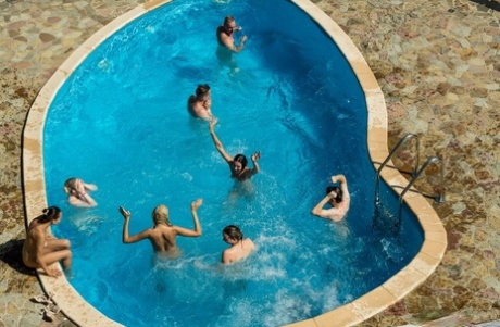 Playful European teens sucking and fucking rock-hard dicks in a poolside orgy