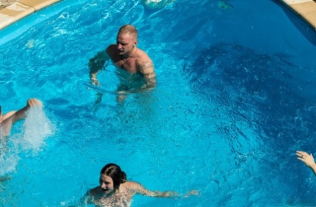 Playful European teens sucking and fucking rock-hard dicks in a poolside orgy