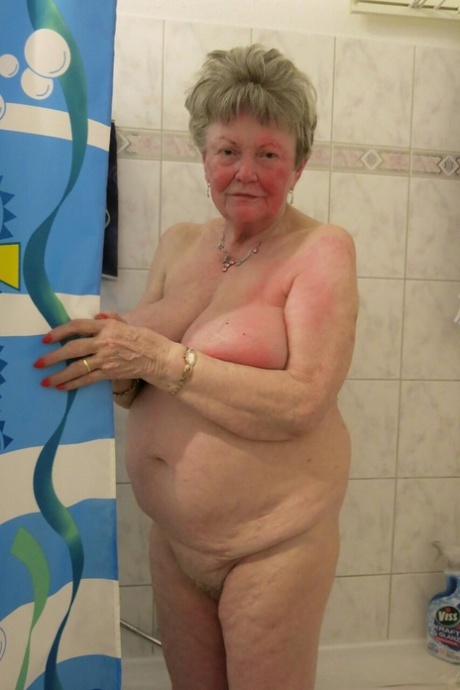 Kinky old granny Phyladelphia doffs her clothes and lets out her huge breasts