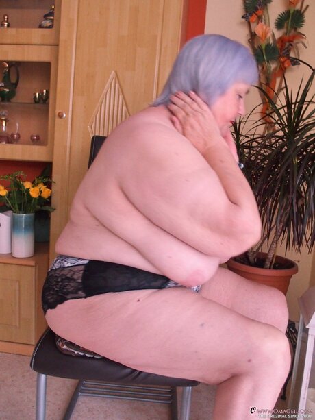 Gorgeous granny Melichora exposing her huge flat ass and big saggy tits
