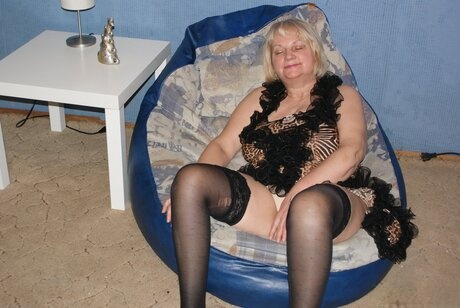 Chubby old granny Helga exposes her big tits and poses in lacy stockings