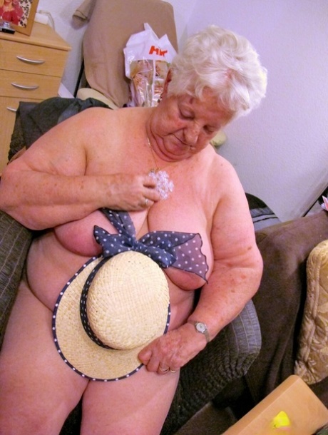 Old granny Natascha strips her clothes off and shows her fat body & saggy tits