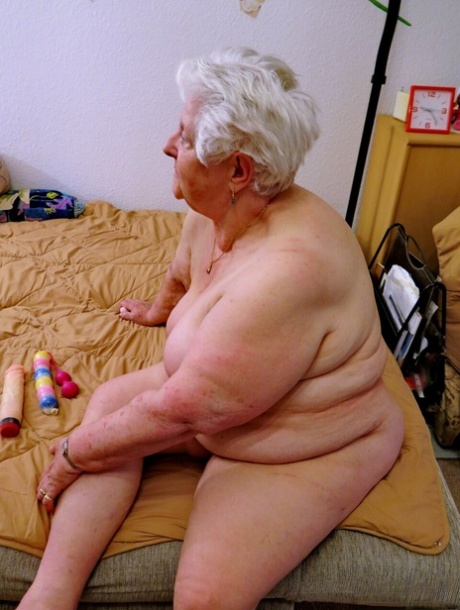 Old granny Natascha strips her clothes off and shows her fat body & saggy tits