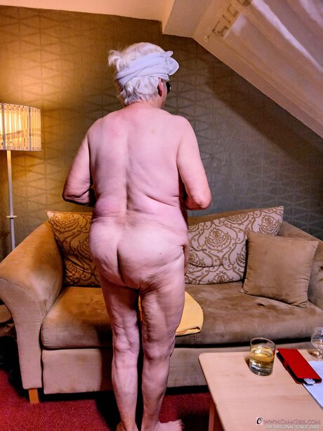 Naughty chubby granny Modesta shows her saggy tits while completely naked