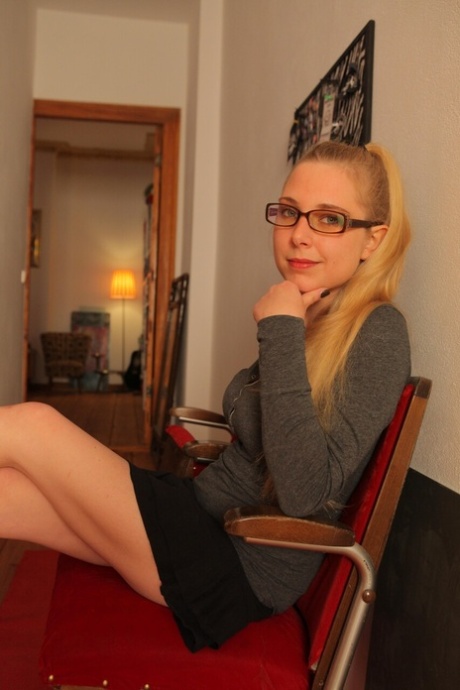 German amateur in glasses Krissi shows her natural boobs and poses naked