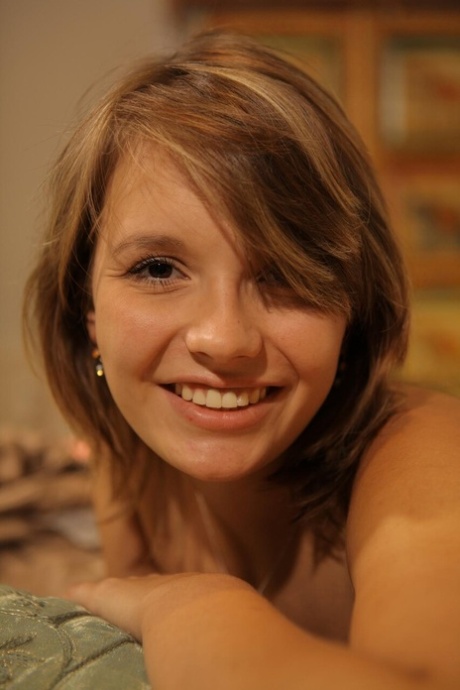 Nice German girl with a pretty face models in the nude for the first time