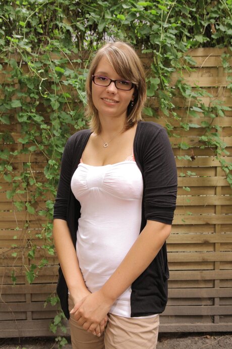 Nice German girl with a pretty face models in the nude for the first time