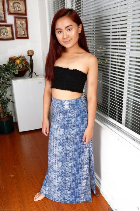 Redhead Asian teen Elle Voneva showcases her yummy feet and delicious holes