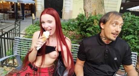 Pale redhead Megan Murkovski eats an ice cream cone before having sex on a bed