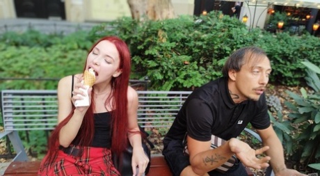 Pale redhead Megan Murkovski eats an ice cream cone before having sex on a bed