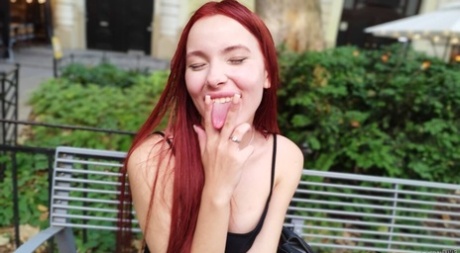 Pale redhead Megan Murkovski eats an ice cream cone before having sex on a bed