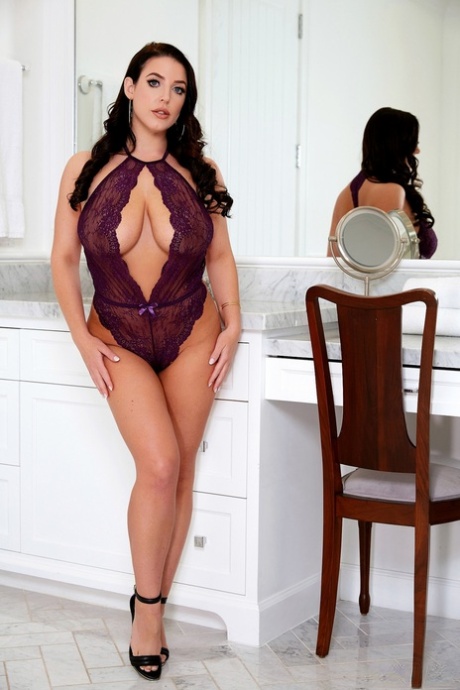 Curvy pornstar Angela White lets out her tits and masturbates on a chair