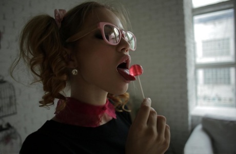 Skinny pigtailed beauty in glasses Bendy plays hotly with her big fake tits