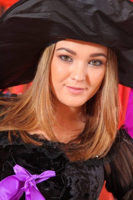 Babe Jodie Gasson strips off her witch costume & poses in her nylon stockings