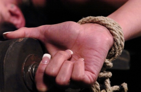 Kinky babe LieLani gets her big nips rope tied and tugged hard on a BDSM wheel
