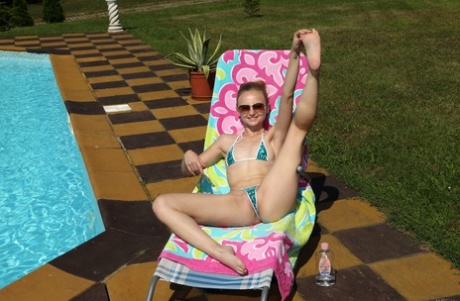 Super skinny Lady Bug strips off her tiny bikini and toys her cunt outdoors