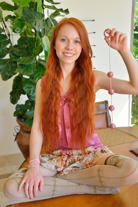 Sexy redhead schoolgirl Dolly stuffing beads into her fresh gaping vagina - pornpics.de