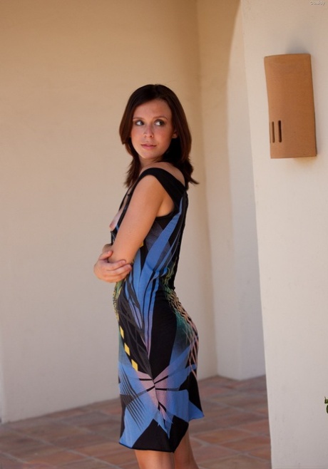 Brunette Cassidy undresses outdoors & flaunts her slender body with tan lines